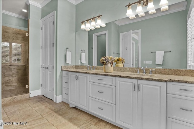 bathroom with double vanity, ornamental molding, a sink, and a shower stall