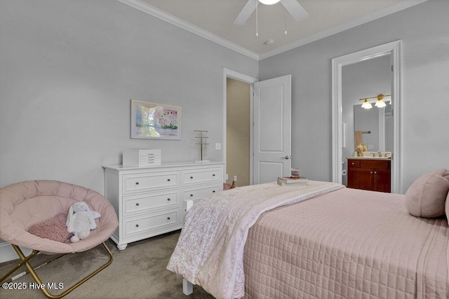 bedroom with ceiling fan, a sink, ornamental molding, ensuite bathroom, and carpet