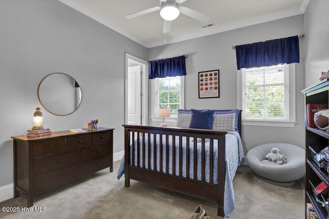 bedroom with crown molding, visible vents, baseboards, ceiling fan, and carpet