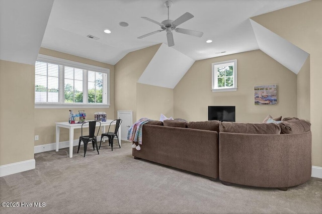 living room with baseboards, a ceiling fan, carpet, and lofted ceiling