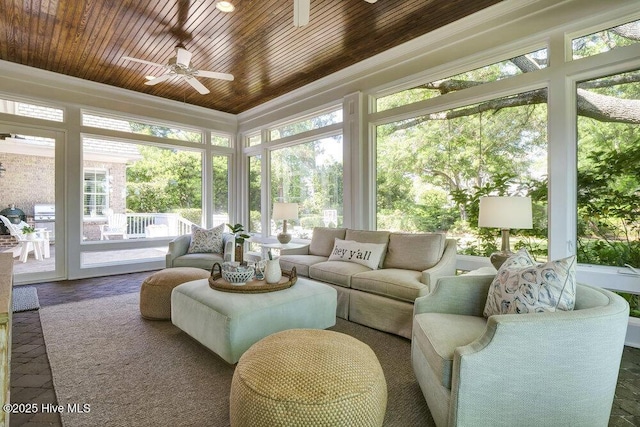 sunroom with ornamental molding and wood ceiling