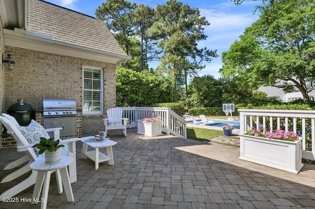 view of patio / terrace with an outdoor pool