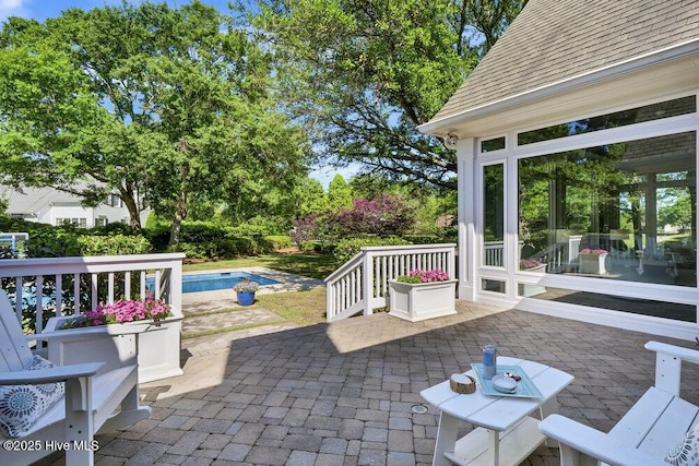 view of patio / terrace with an outdoor pool