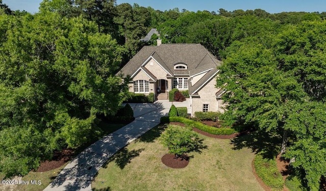 aerial view featuring a wooded view
