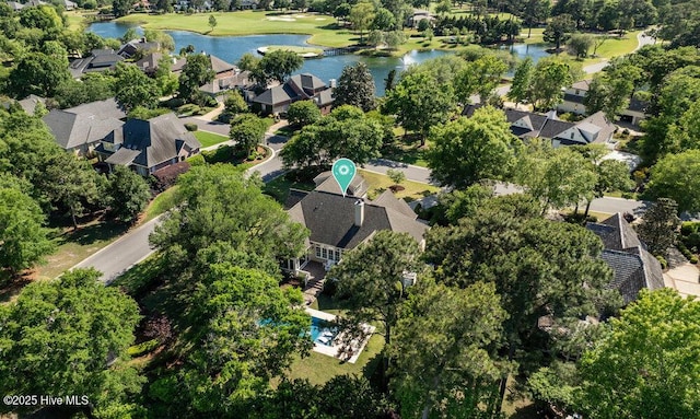 birds eye view of property featuring a water view, view of golf course, and a residential view