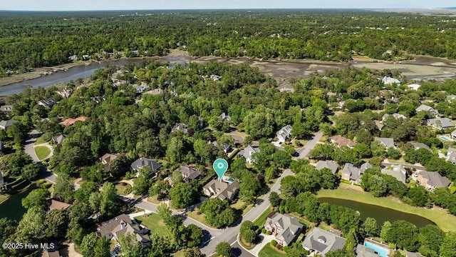 aerial view with a residential view, a water view, and a wooded view