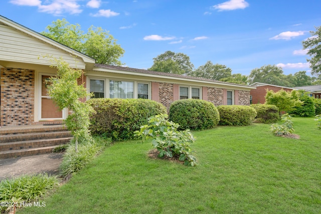 2022 Pinedale Rd, Rockingham, NC 28379 - ranch-style house featuring a front lawn, brick siding, and entry steps