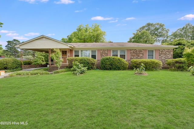 2022 Pinedale Rd, Rockingham, NC 28379 - single story home with a front lawn, brick siding, and a carport