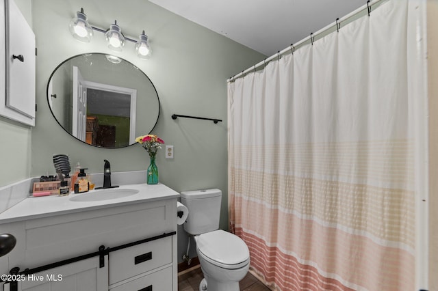 bathroom featuring toilet, a shower with curtain, vanity, and wood finished floors