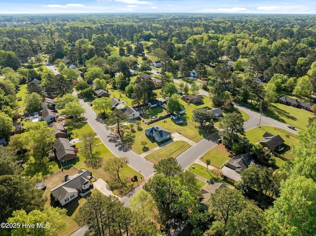 aerial view with a residential view and a wooded view