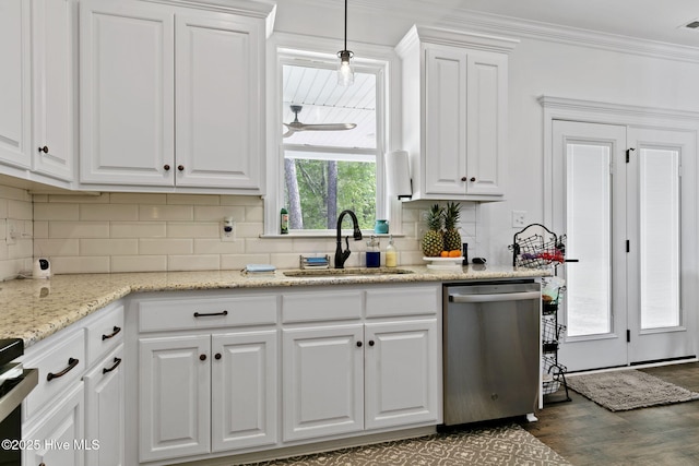 kitchen with white cabinets, appliances with stainless steel finishes, a sink, and dark wood-style floors