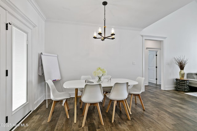 dining area with baseboards, an inviting chandelier, ornamental molding, and dark wood finished floors