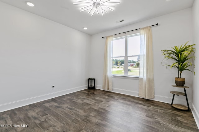 spare room featuring recessed lighting, visible vents, baseboards, and dark wood-style flooring