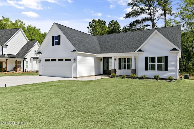 view of front of house featuring central air condition unit, roof with shingles, a front lawn, and concrete driveway