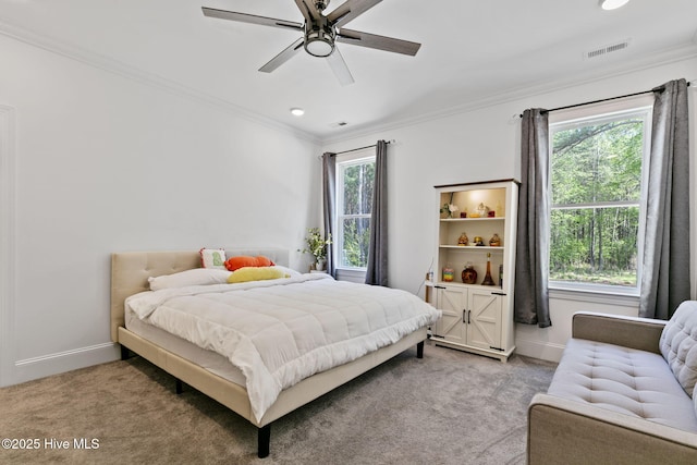 bedroom with light carpet, baseboards, and ornamental molding
