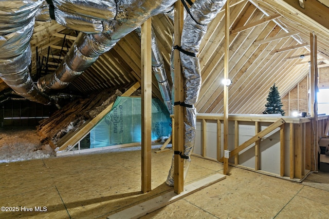 attic featuring an upstairs landing