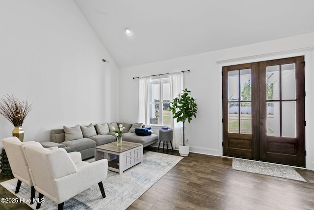 living room with recessed lighting, wood finished floors, french doors, baseboards, and high vaulted ceiling