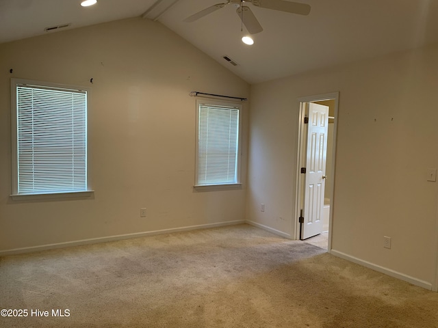 unfurnished room featuring lofted ceiling with beams, baseboards, a ceiling fan, and carpet flooring