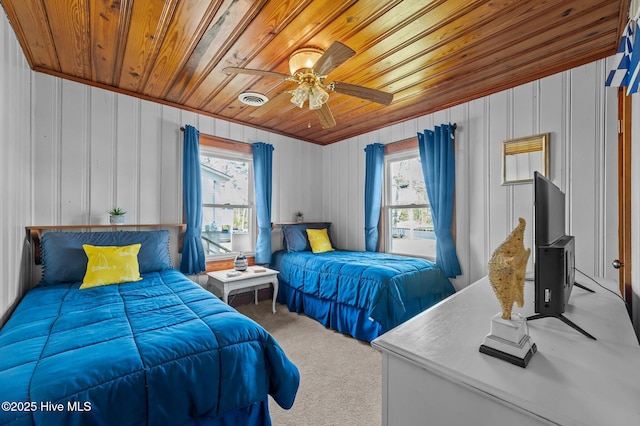 bedroom featuring wooden ceiling, visible vents, carpet floors, and ceiling fan