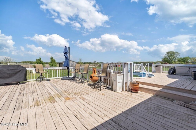 wooden terrace with a grill