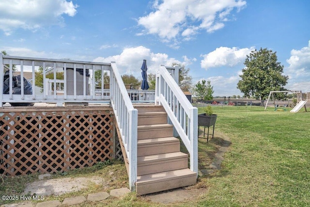 exterior space featuring a lawn and stairs