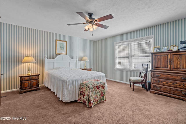 bedroom with carpet floors, wallpapered walls, and baseboards
