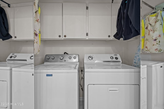 laundry area featuring cabinet space and independent washer and dryer
