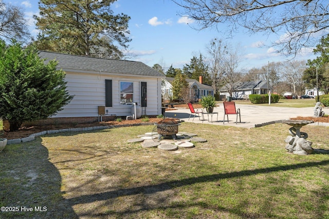 view of yard with an outdoor fire pit