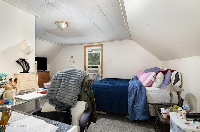 302 N Saratoga St, Stantonsburg, NC 27883 - bedroom with vaulted ceiling, cooling unit, and carpet