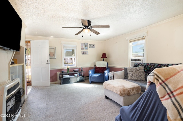 302 N Saratoga St, Stantonsburg, NC 27883 - carpeted living area featuring crown molding, heating unit, wainscoting, cooling unit, and ceiling fan