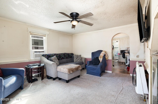 302 N Saratoga St, Stantonsburg, NC 27883 - carpeted living area featuring arched walkways, cooling unit, heating unit, ceiling fan, and ornamental molding