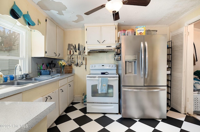 302 N Saratoga St, Stantonsburg, NC 27883 - kitchen featuring white electric range oven, a sink, stainless steel fridge, light floors, and under cabinet range hood