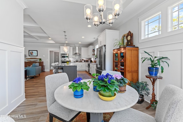 3981 Bay Colony Rd NE, Leland, NC 28451 - dining room featuring recessed lighting, a chandelier, light wood-style floors, coffered ceiling, and beamed ceiling