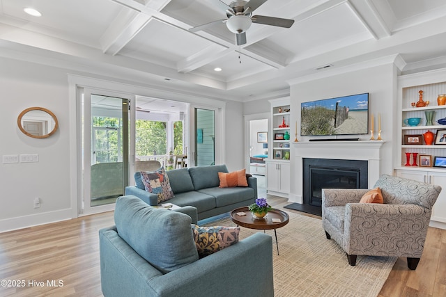 3981 Bay Colony Rd NE, Leland, NC 28451 - living room with light wood-type flooring, a ceiling fan, coffered ceiling, a fireplace with flush hearth, and beam ceiling