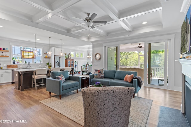 3981 Bay Colony Rd NE, Leland, NC 28451 - living room featuring ceiling fan, light wood-style flooring, recessed lighting, beam ceiling, and a fireplace with flush hearth