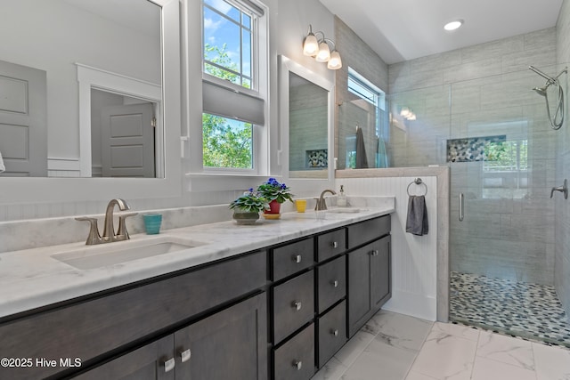 3981 Bay Colony Rd NE, Leland, NC 28451 - bathroom featuring plenty of natural light, a shower stall, double vanity, marble finish flooring, and recessed lighting