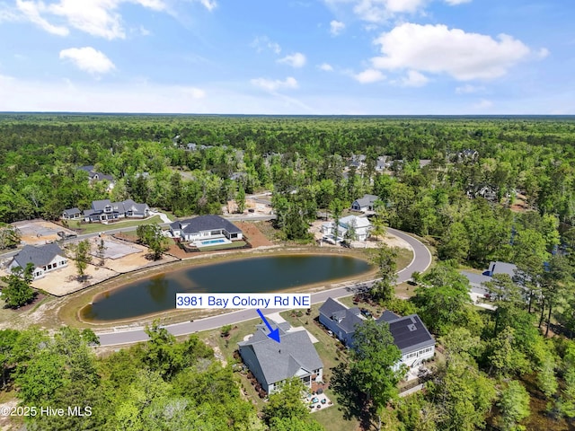 3981 Bay Colony Rd NE, Leland, NC 28451 - aerial view of property's location featuring a heavily wooded area, nearby suburban area, and a large body of water
