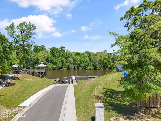 3981 Bay Colony Rd NE, Leland, NC 28451 - dock area with a water view and a yard