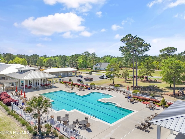 3981 Bay Colony Rd NE, Leland, NC 28451 - community pool with a patio area and view of wooded area