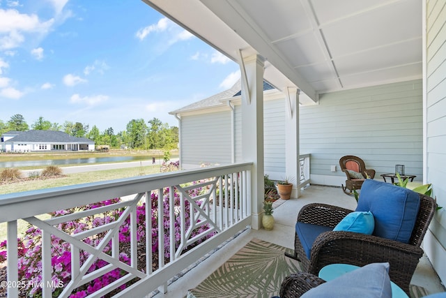 3981 Bay Colony Rd NE, Leland, NC 28451 - porch featuring a water view