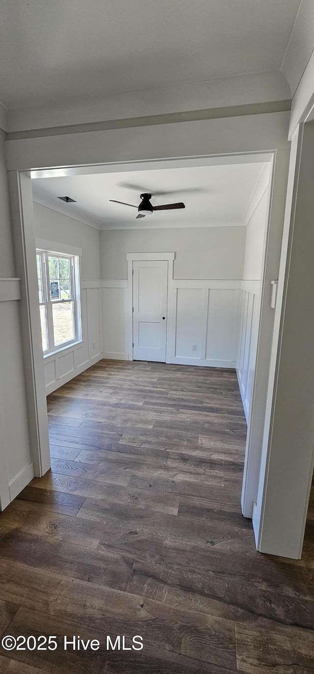 25 Pinewood Dr, Carolina Shores, NC 28467 - hall with a decorative wall, dark wood-type flooring, ornamental molding, and wainscoting