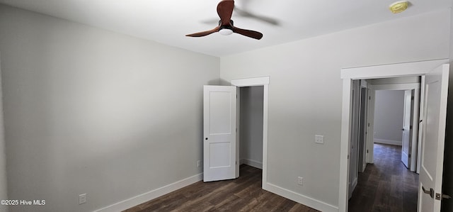 25 Pinewood Dr, Carolina Shores, NC 28467 - unfurnished bedroom featuring dark wood-style floors, baseboards, and ceiling fan