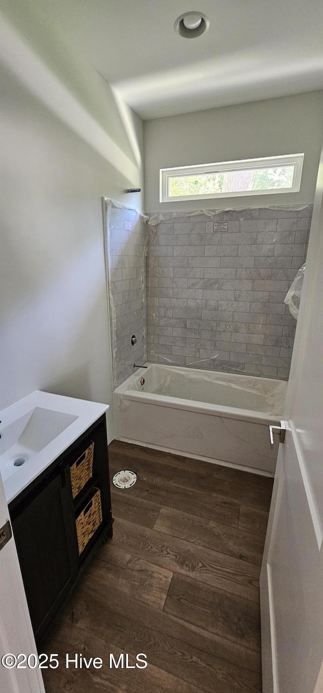 25 Pinewood Dr, Carolina Shores, NC 28467 - full bath featuring vanity, wood finished floors, and shower / bath combination