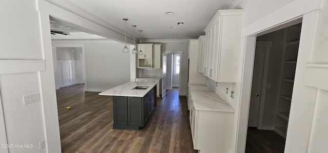 25 Pinewood Dr, Carolina Shores, NC 28467 - kitchen with a kitchen island, dark wood-type flooring, light stone countertops, white cabinetry, and recessed lighting