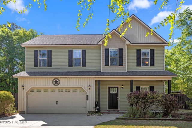 259 Luther Banks Rd, Richlands, NC 28574 - craftsman house featuring driveway, board and batten siding, an attached garage, a porch, and roof with shingles