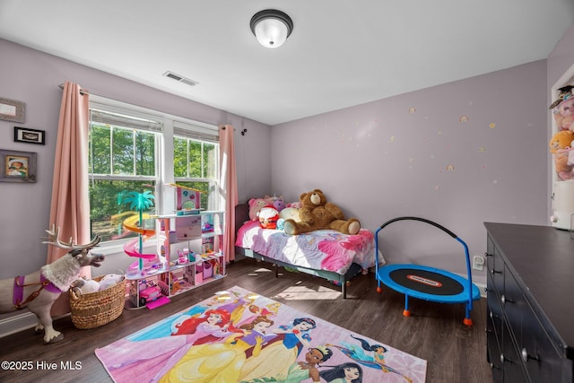 259 Luther Banks Rd, Richlands, NC 28574 - bedroom featuring baseboards, wood finished floors, and visible vents