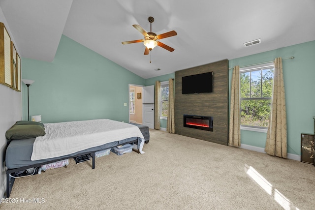 259 Luther Banks Rd, Richlands, NC 28574 - bedroom with a large fireplace, baseboards, lofted ceiling, carpet flooring, and visible vents