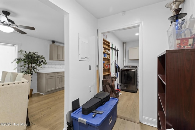 interior space featuring light wood-style floors and washer / clothes dryer