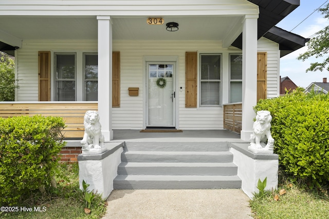doorway to property featuring covered porch