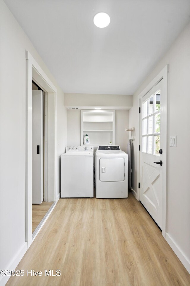 304 S 18th St, Wilmington, NC 28403 - laundry area with washing machine and clothes dryer, light wood-type flooring, and baseboards